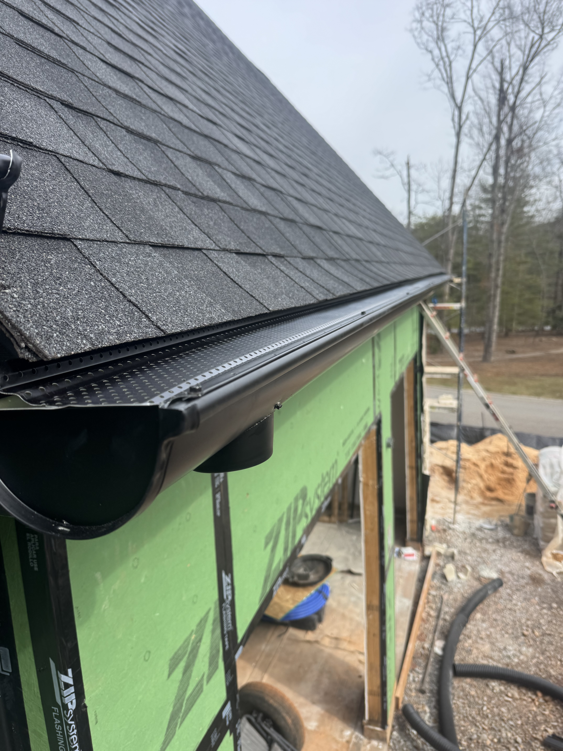 Black gutters on green sheathing | GutterCo (Gutter) (Gallery) (Guards)