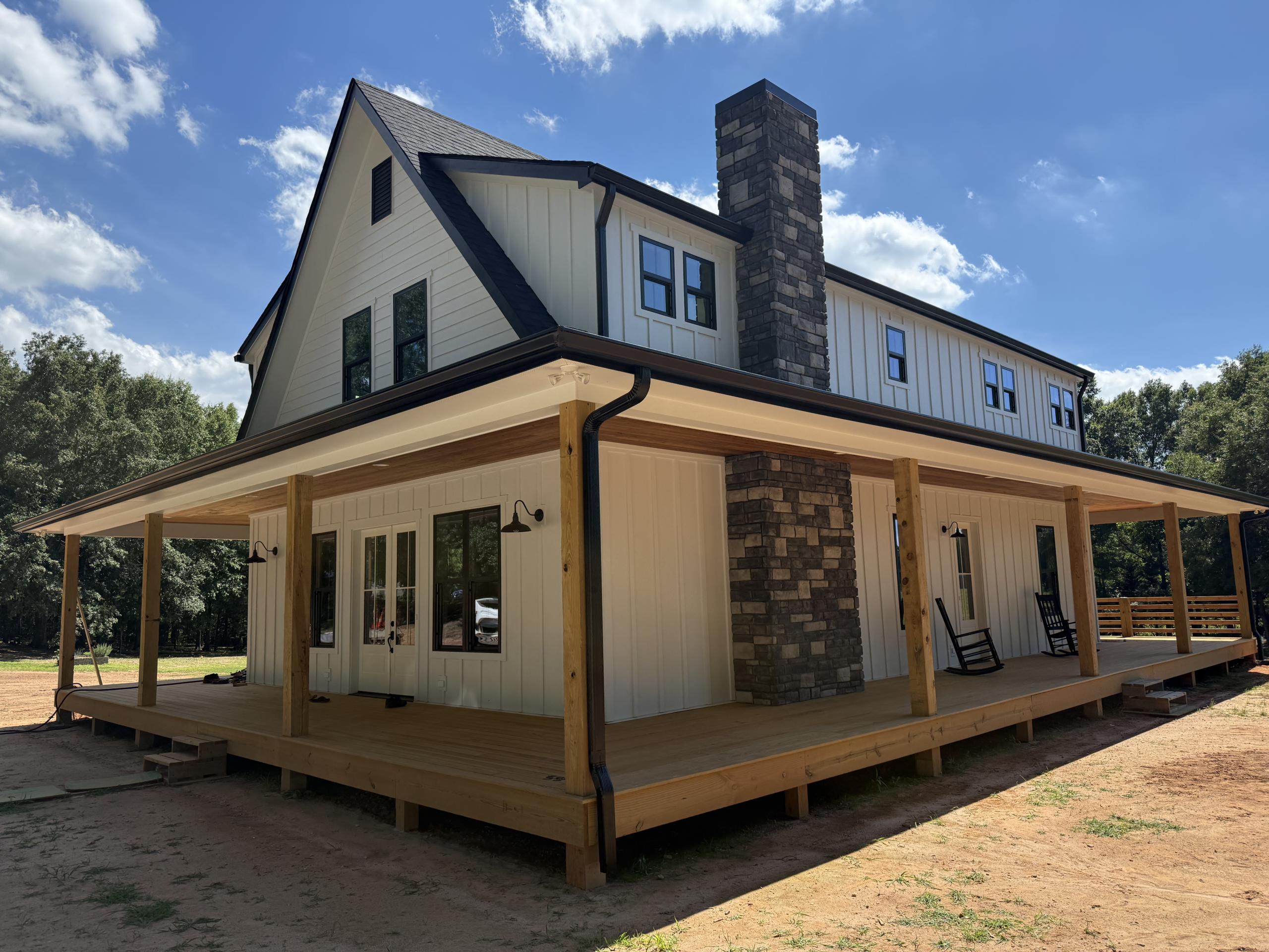 Modern farmhouse with wrap porch | GutterCo (About )