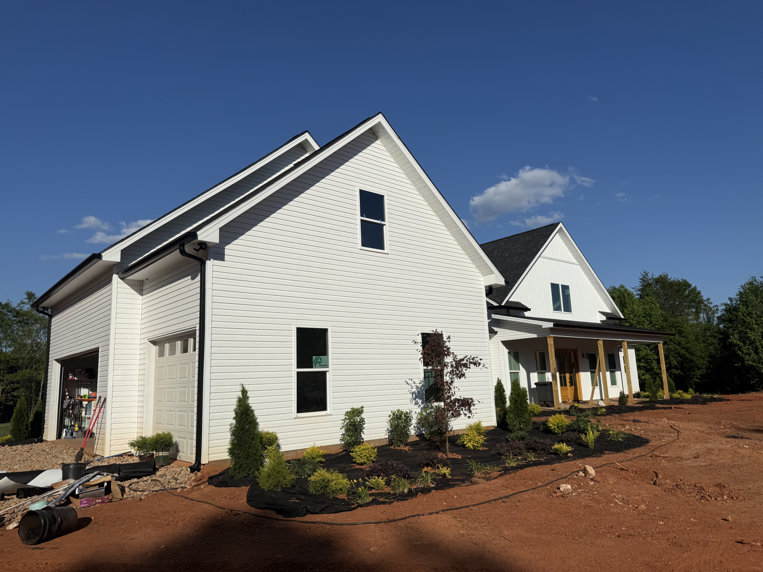 Modern white farmhouse with gables | GutterCo (Gutter) (Gallery)