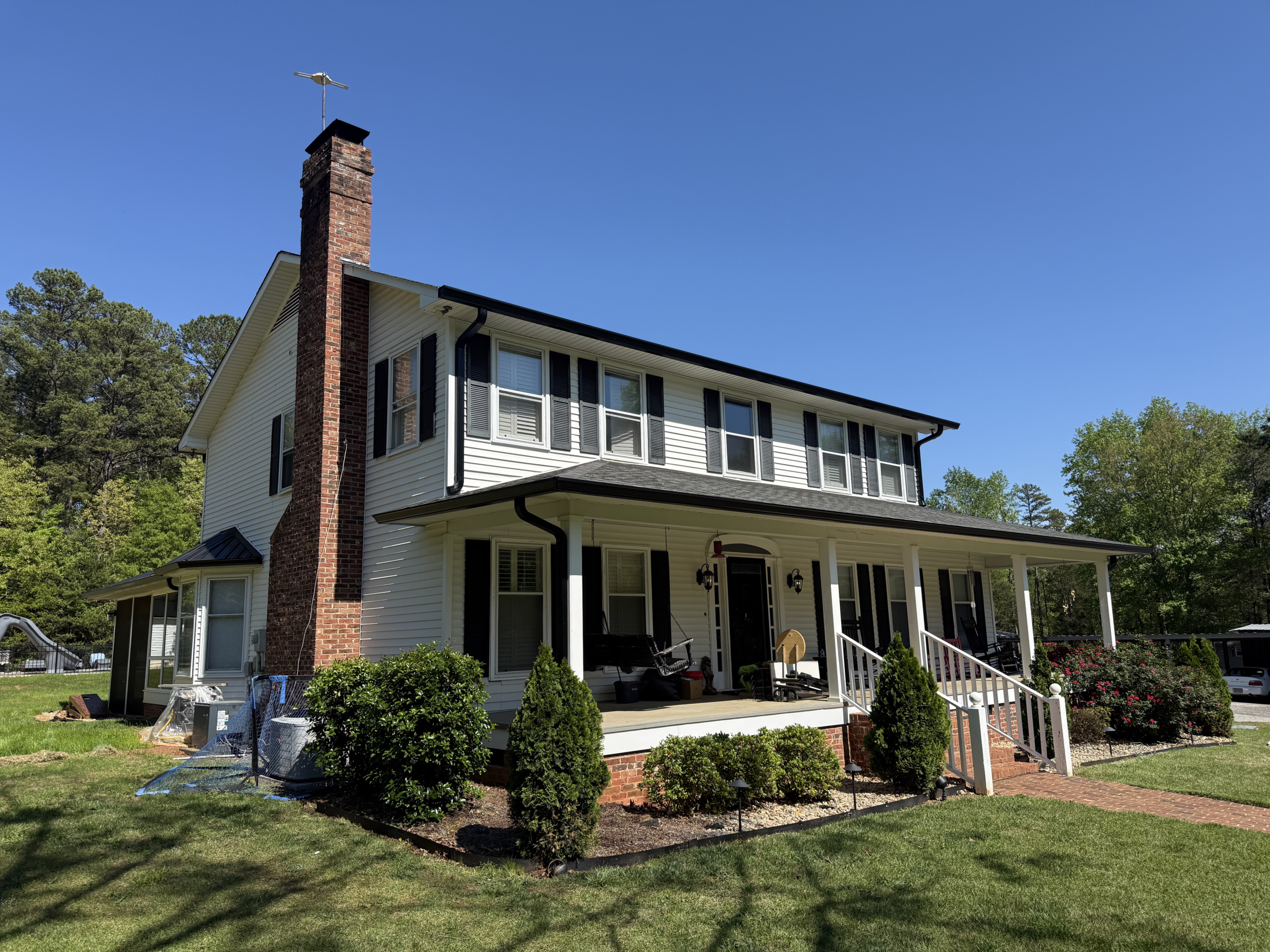 Two-story house with front porch | GutterCo (About ) (Gallery)