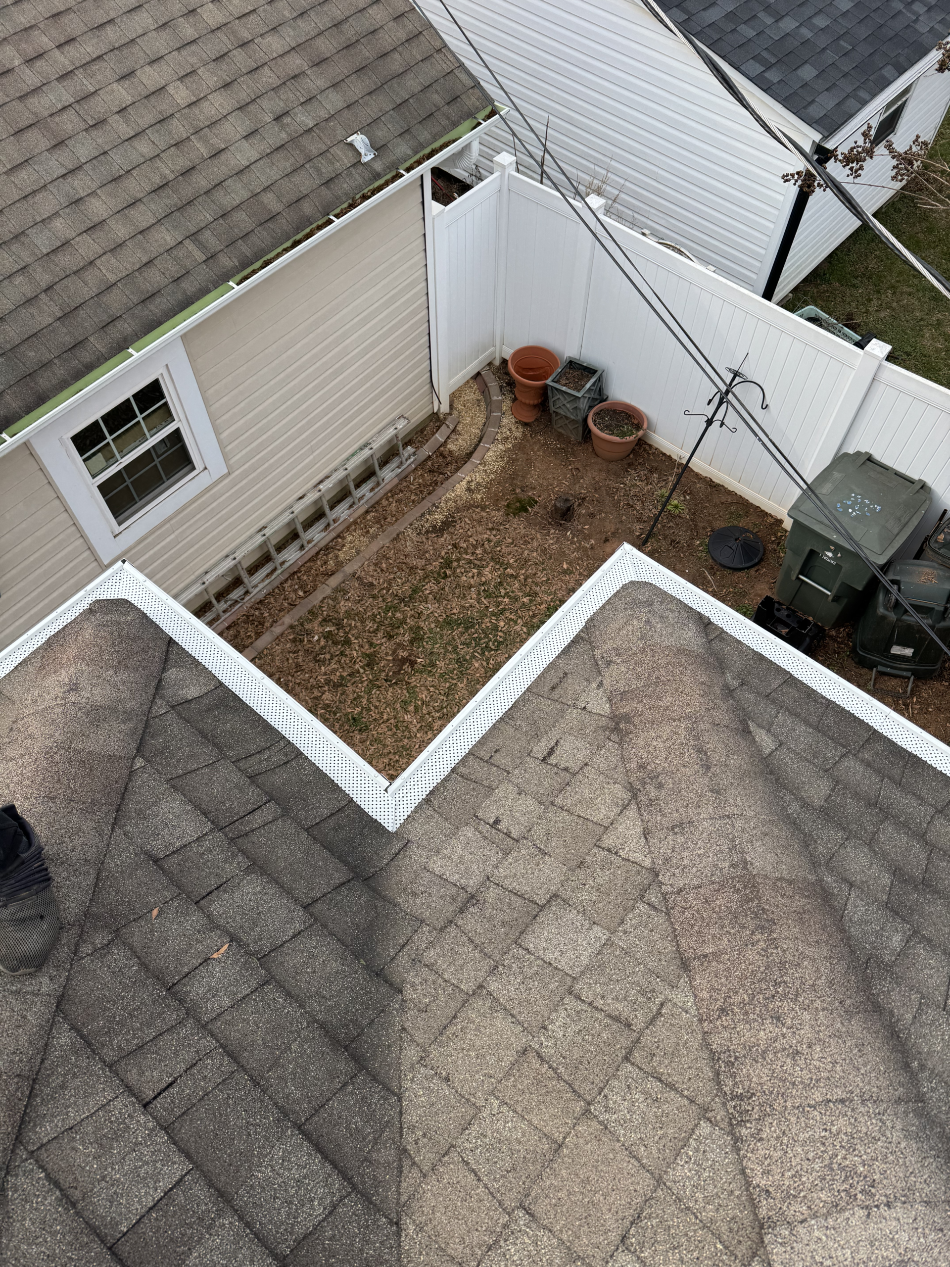 Roof and fenced backyard from above | GutterCo (Commercial Gutter)